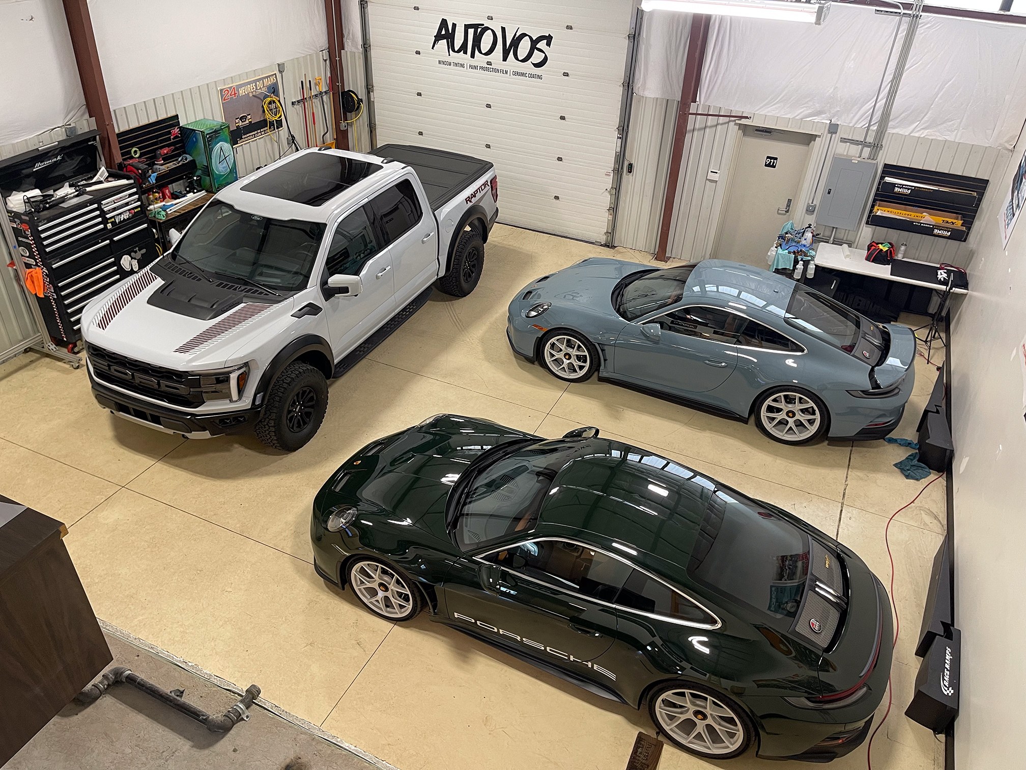 Vehicles in the Auto Vos work bays, seen from above Vehicles in the Auto Vos work bays, seen from above