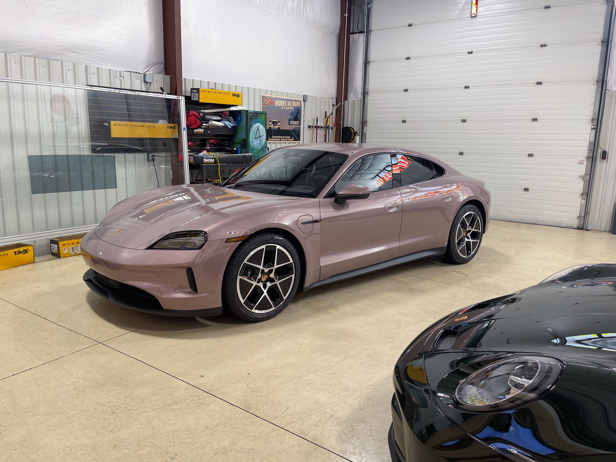 Rose-colored Porsche Taycan with tinted side windows at Auto Vos Rose-colored Porsche Taycan with tinted side windows at Auto Vos